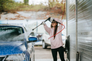 Demonstrating correct electric pressure washer usage technique for optimal cleaning results