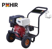Technician servicing gas-powered pressure washer engine