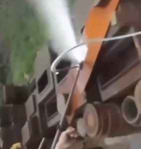 High flow pressure washer cleaning construction site